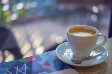 Wall Mural - White coffee cup on table