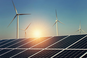 Wall Mural - solar panel and wind turbine with sunrise background. concept clean energy