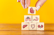 © dragonstock - Hand arranging internal organ icons