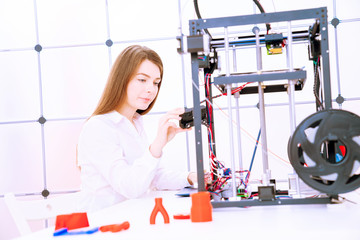 Canvas Print - Young women designer in 3d printing lab