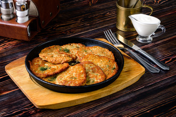 Canvas Print - Draniki - potato fritters. potato pancakes. The naitonal dish of Belarus, Ukraine and Russia