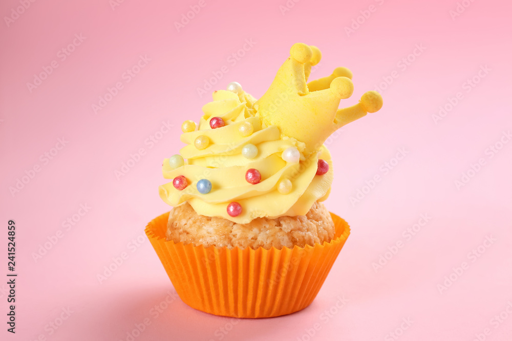 Tasty cupcake on color background