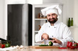 © Pixel-Shot - Male chef cooking in kitchen