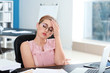© Pixel-Shot - Stressed businesswoman working in office
