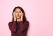 © Pixel-Shot - Stressed young woman on color background