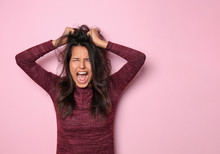 Screaming Young Woman On Color Background