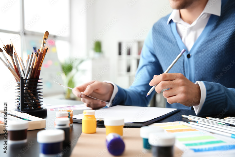 Young designer working in office