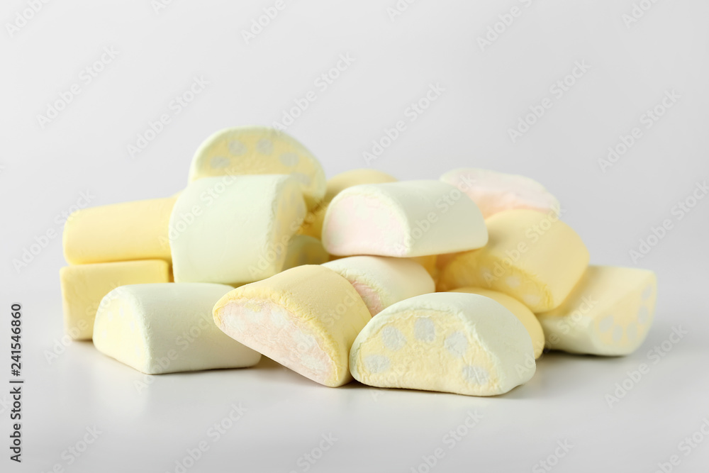 Tasty marshmallows on light background