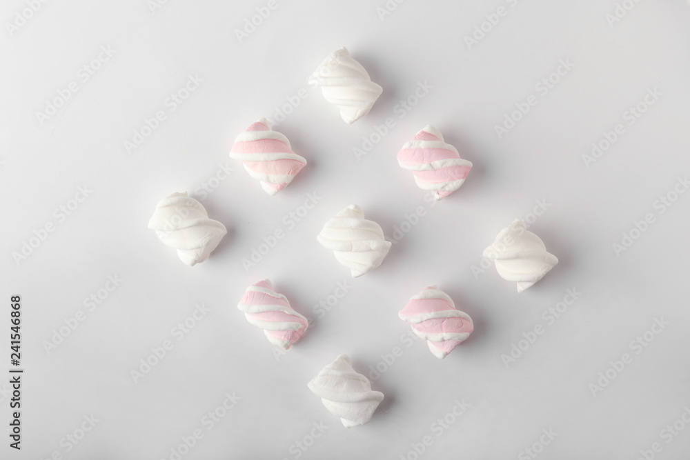 Tasty marshmallows on light background
