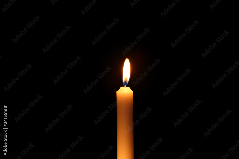 Beautiful burning candle on dark background