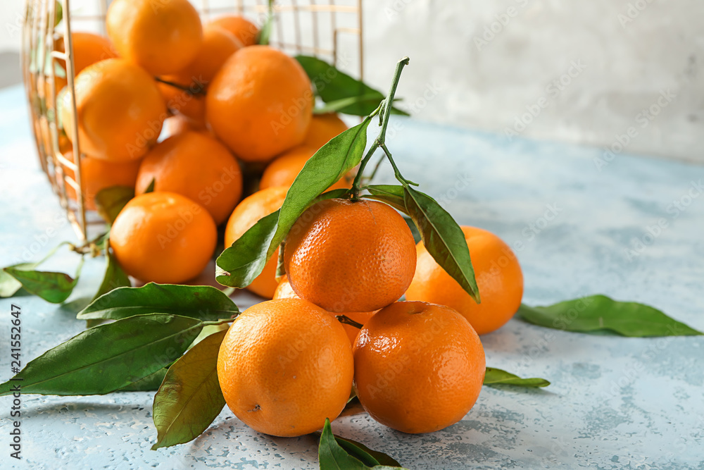 Tasty juicy tangerines on light table