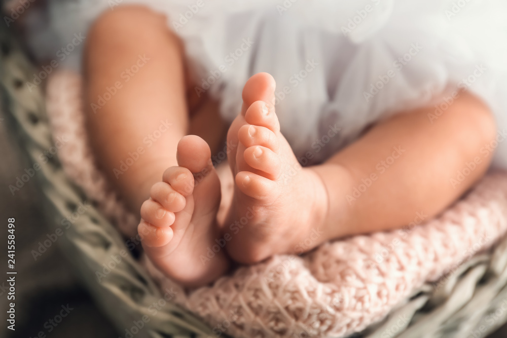 Tiny feet of cute little baby, closeup