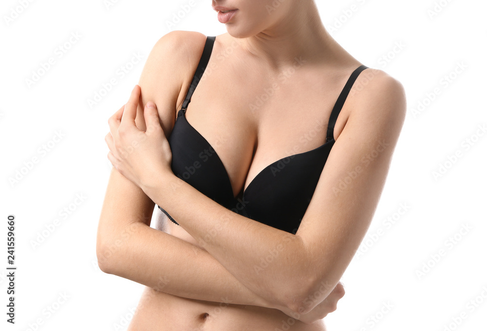 Young woman with beautiful breast on white background