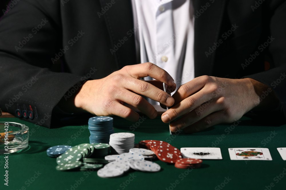 Male player at table in casino