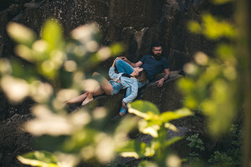 Wall Mural - Relaxing after hiking. Sensual couple on vacation trip. Couple in love on summer vacation. Sexy woman and bearded man on natural landscape. Couple enjoy love and romance