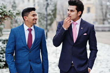 Two elegant indian fashionable mans model on suit posed at winter day.