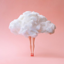 Girl Doll Against Pastel Coral Color Background. Head In The Clouds Concept.