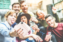 Group Of Millennials People Taking Selfie With Instant Camera At Party Outdoor - Focus On Photocamera Hand