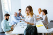 © BGStock72 - Elegant businesswoman standing in office with digital tablet