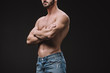 © LIGHTFIELD STUDIOS - cropped view of muscular man posing with crossed arms isolated on black