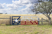 Texas Lone Star Flag Painted On Gate To Grazing Meadow