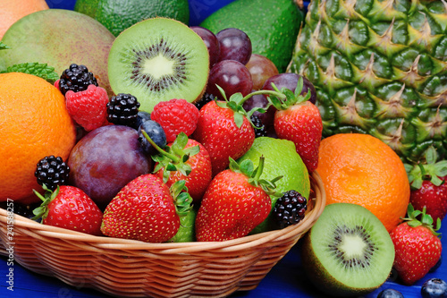 Fotografie, Obraz Fresh fruits in a basket on wooden table