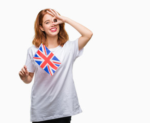 Wall Mural - Young beautiful woman holding flag of united kingdom over isolated background with happy face smiling doing ok sign with hand on eye looking through fingers