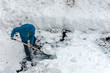 Man shoveling snow.   Winter season work. Street cleaning.