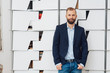 © contrastwerkstatt - Stylish man in blazer and jeans front portrait