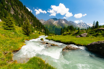 Beautiful summer landscape of mountains and fresh water in river, Tyrol Alps, Austria