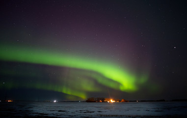 colorful northern lights over a saskatchewan prairies winter landscape at night