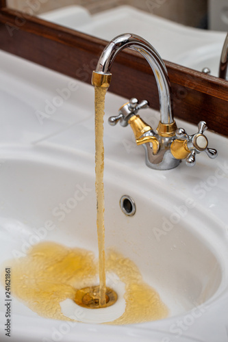 Dirty Water Flows From The Faucet Buy This Stock Photo And