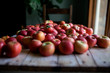 © Cavan Images - Close-up of fresh red apples on table at home