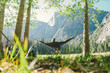 © Cavan Images - Rear view of woman relaxing in hammock at Yosemite National Park