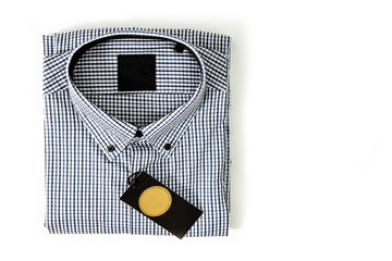 Poster - Top view of a business shirt isolated on whitel background. The concept of fashion and sale of clothes for men, business and luxury shirts. Blue plaid shirt on the table.