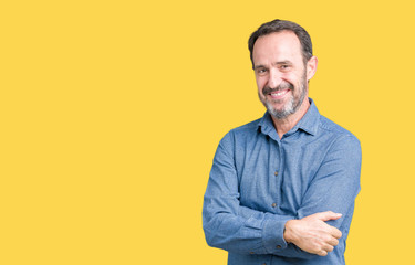 Handsome middle age elegant senior man over isolated background happy face smiling with crossed arms looking at the camera. Positive person.