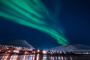 the polar arctic northern lights aurora borealis sky star in norway svalbard in longyearbyen the moo