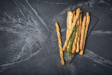 Wall Mural - Top view of traditional italian appetizer grissini with rosemary spice