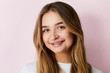 © sanneberg - Pretty young woman gainst pink background