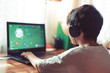 © sakkmesterke - Little dependent gamer boy playing on laptop