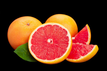 Wall Mural - orange and grapefruit on black background