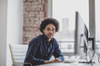 © ReeldealHD images - Portrait of businessman working on desktop computer in office