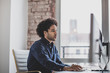 © ReeldealHD images - Side view of businessman working on desktop computer in office
