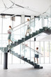 © moodboard - Full length of businesswomen on staircase at new office