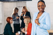 © alfa27 - Happy African female woman, member of multiracial team, looking at camera while resting after briefing in conference hall