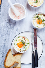 Oeufs En Cocotte Individual Baked Eggs With Spinach, Feta, Bacon, Eggs, And Slices Of Bread