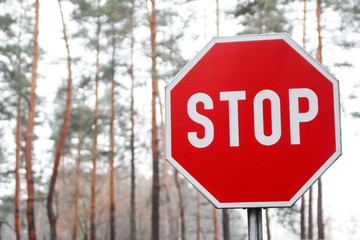 Red stop sign for traffic control.