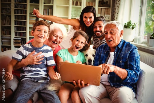 Fotografie, Tablou  Portrait of happy multi generation using laptop