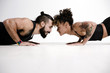 © TONL - Couple exercising against white background
