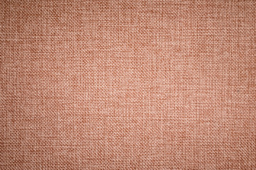 Textured background surface of textile upholstery furniture close-up. burlap brown color fabric structure